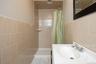 One of the two bathrooms in the basement this is the one with a shower