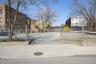 Includes a private gated parking lot accommodating 14+ vehicles — a rare and valuable amenity in this area