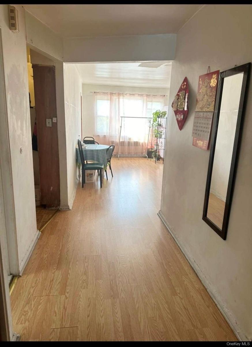 Hallway with wood finished floors