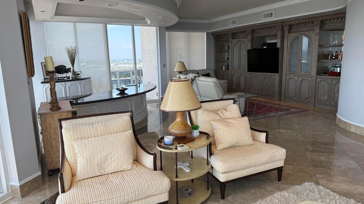Living room far end with Bar.