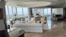 Living Room with bar on the end and media center on right.