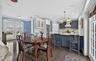 Dining area featuring french doors, crown molding, dark wood-style floors, and recessed lighting