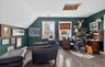 Home office featuring hardwood / wood-style floors and lofted ceiling