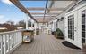 Deck with french doors and outdoor dining area