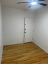 Spare room featuring ceiling fan and light wood finished floors
