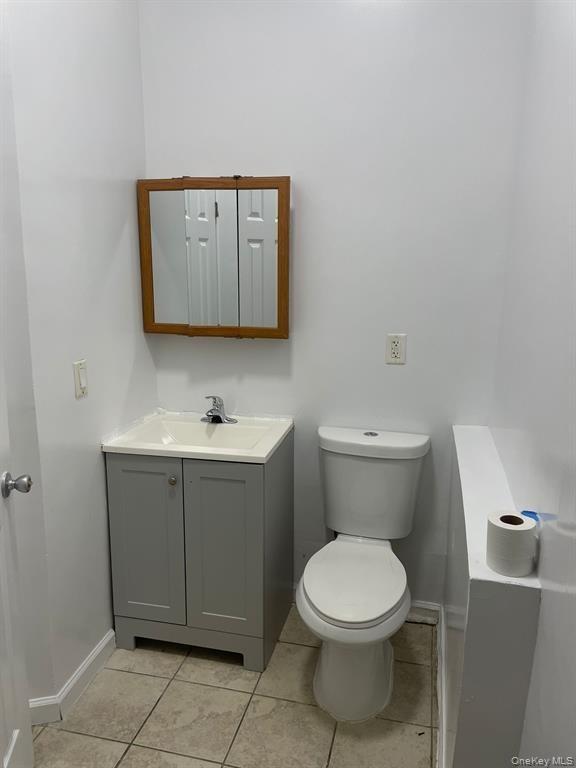 Bathroom featuring vanity and light tile patterned floors