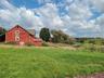 View of yard with a rural view and an outbuilding