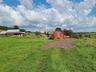 View of yard featuring a rural view and an outdoor structure