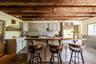 Kitchen with a sink, decorative backsplash, a kitchen breakfast bar, and stainless steel built in refrigerator