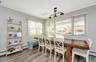 Dining area featuring hardwood / wood-style floors, breakfast area, plenty of natural light, and crown molding