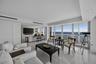 Living Room with Sliding Wall System To Den Opened