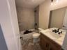 Full bath with vanity and bathtub / shower combination