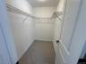 Walk in closet in primary bedroom