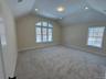 featuring carpet flooring, recessed lighting and tray ceiling