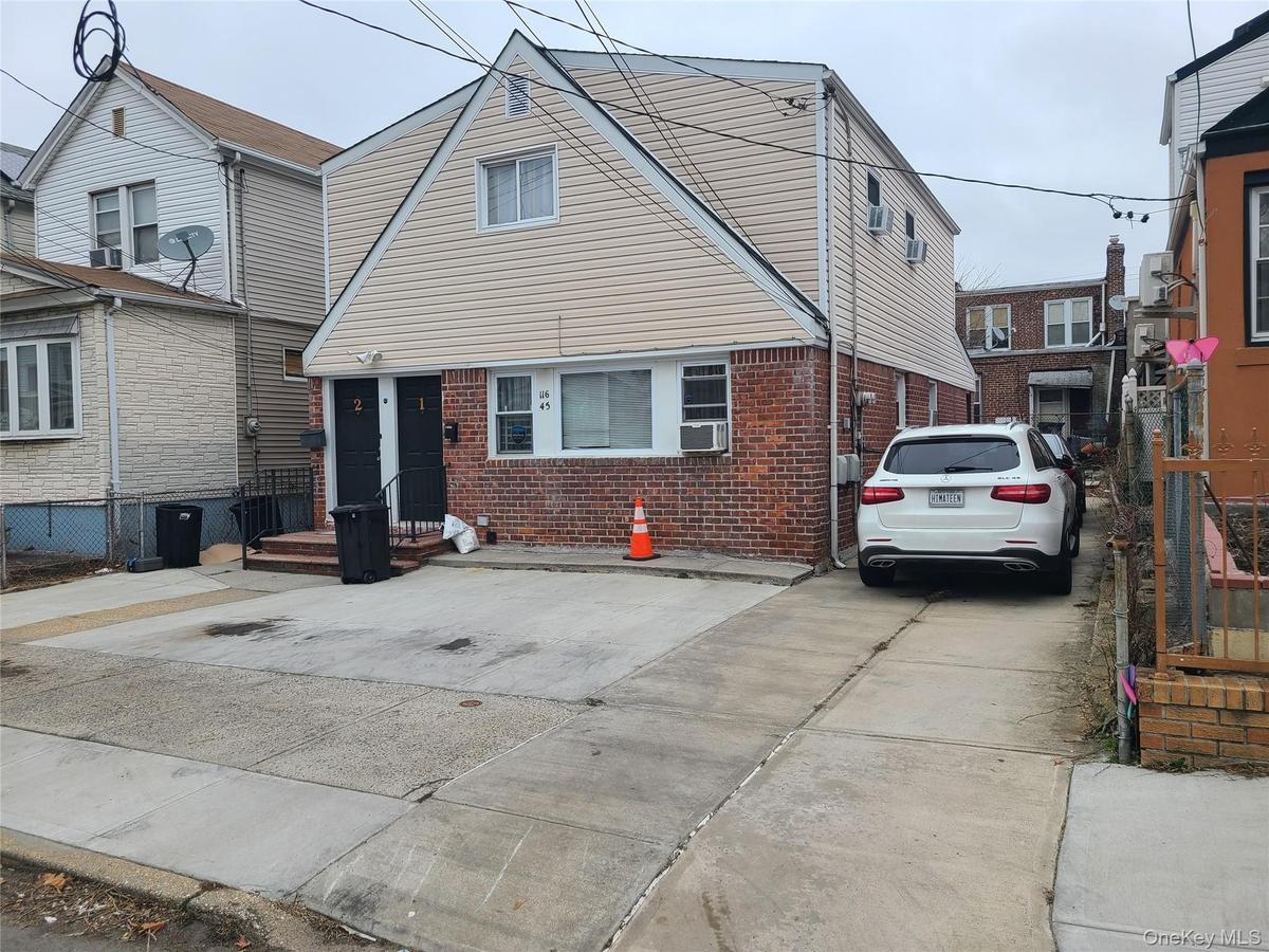 View of front of home featuring brick siding