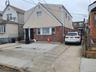 View of front of home featuring brick siding