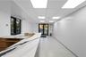 Corridor featuring a paneled ceiling and french doors