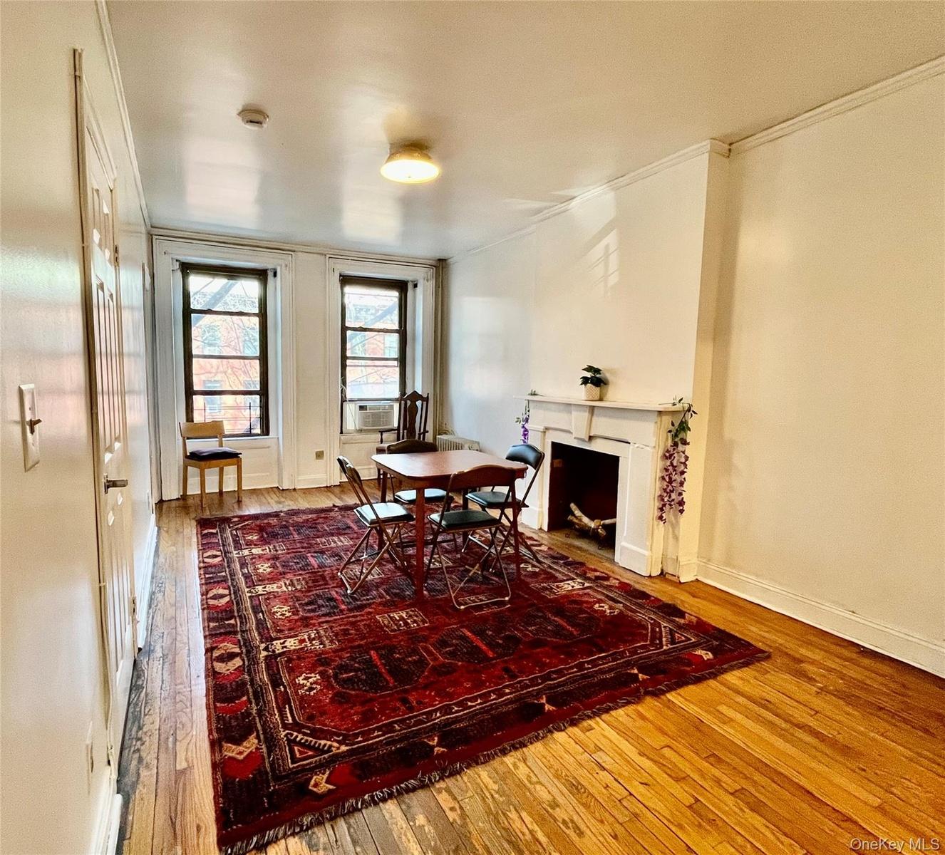 This lovely apartment has original hardwood floors throughout the living room and entry hallway.  The space is beautifully lit by both the morning and