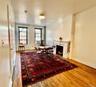 This lovely apartment has original hardwood floors throughout the living room and entry hallway.  The space is beautifully lit by both the morning and