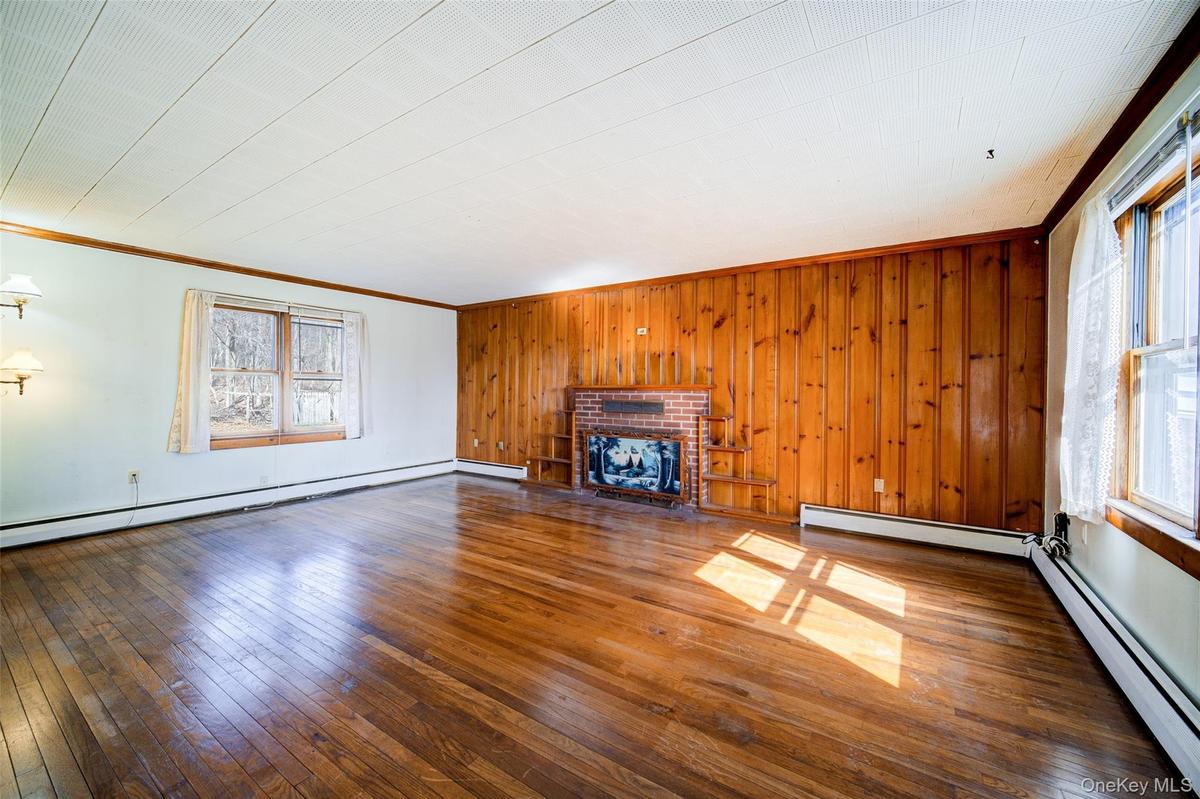 Apartment Living Room with Hardwood Floors and Fire Place