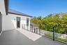 The second-floor terrace is accessible from the primary and third bedrooms.