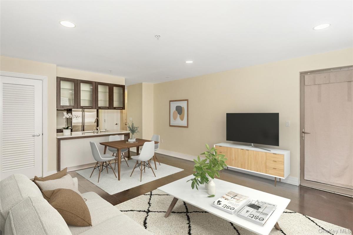 Living room with recessed lighting and wood finished floors