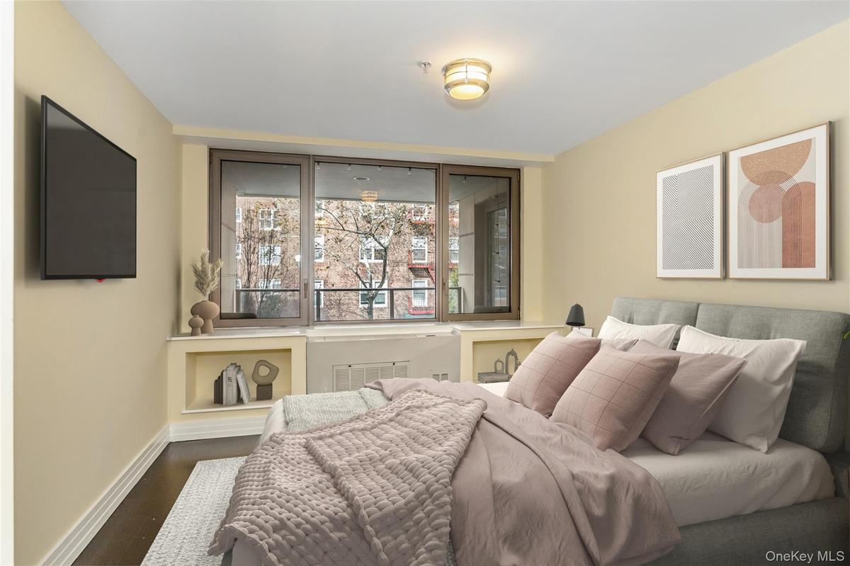 Bedroom featuring baseboards and wood finished floors