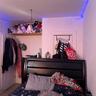 Front Apt's primary bedroom, closet door pictured as well