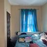 Rear Apt's primary bedroom , additional closet pictured as well
