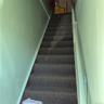 Stairs leading to the front and rear apartments.