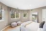 Bedroom with light wood-style flooring, recessed lighting and multiple windows