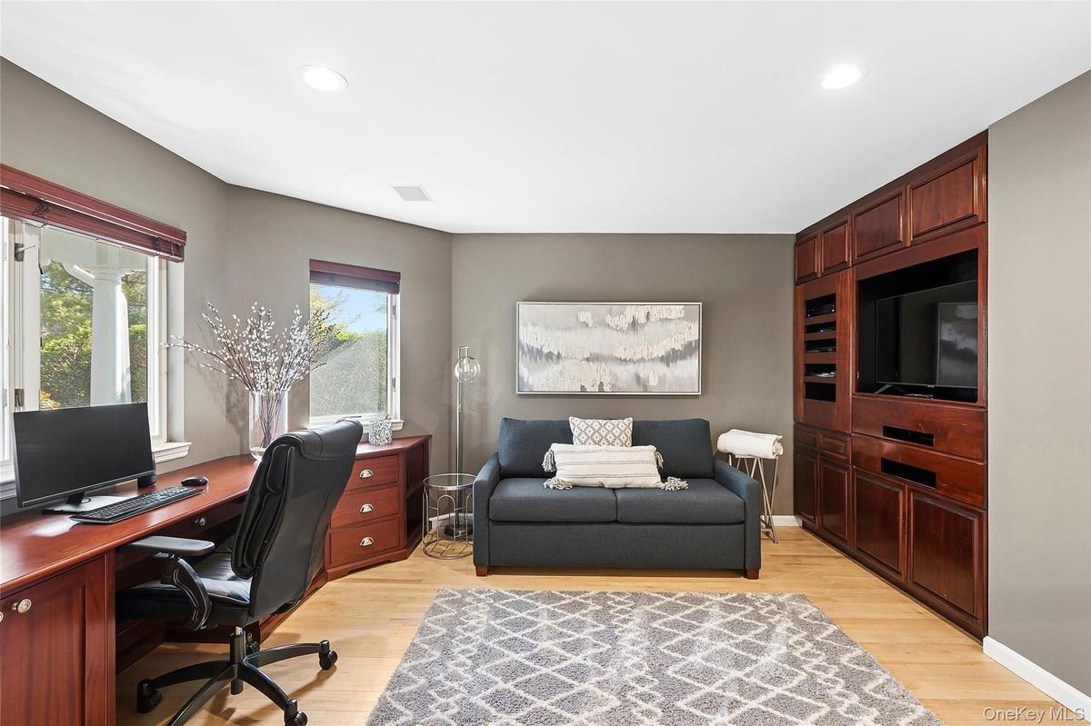 Bedroom/Office with light wood-style floors and recessed lighting