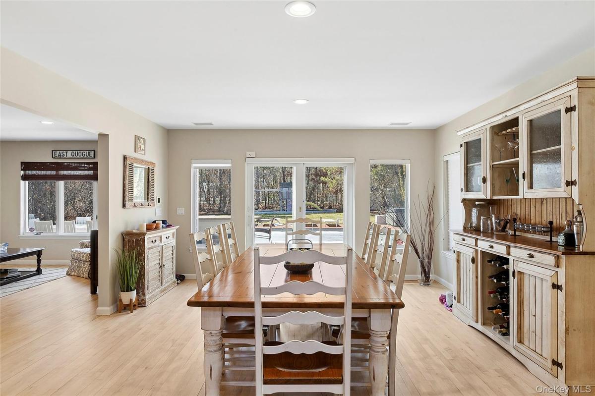 Dining area featuring light wood-style flooring and recessed lighting and sliders to yard.