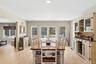 Dining area featuring light wood-style flooring and recessed lighting and sliders to yard.