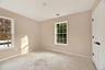 Spare room featuring baseboards
