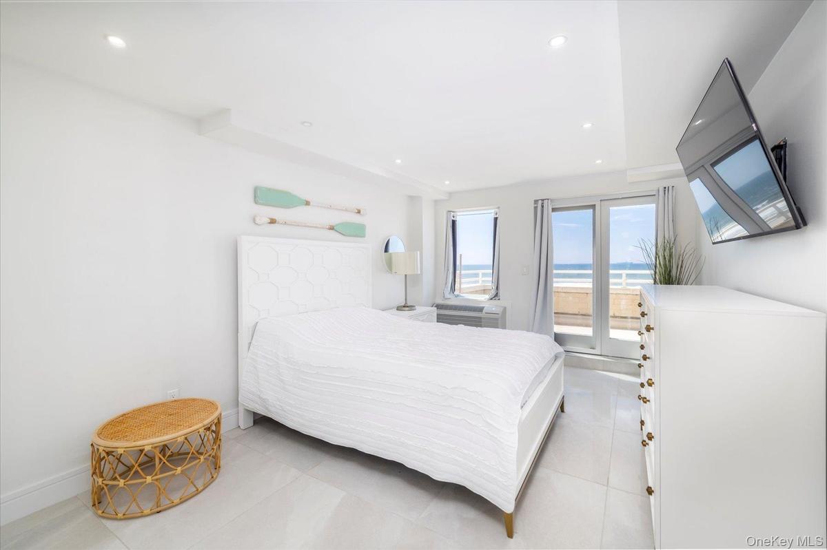 Bedroom with Direct oceanfront views and Access to balcony. Walk in closet.