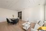 Living room with light wood finished floors and recessed lighting