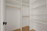 Spacious closet featuring light wood-type flooring
