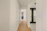 Hallway featuring light wood-type flooring and french doors