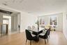 Dining area with light wood-style flooring, radiator heating unit, and recessed lighting