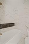 Full bath with toilet and marble tiled floors