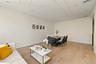 Living area featuring light wood finished floors and recessed lighting