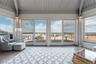 Sunroom featuring vaulted ceiling, wooden ceiling, and hardwood / wood-style flooring
