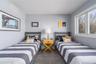 Carpeted bedroom featuring visible vents