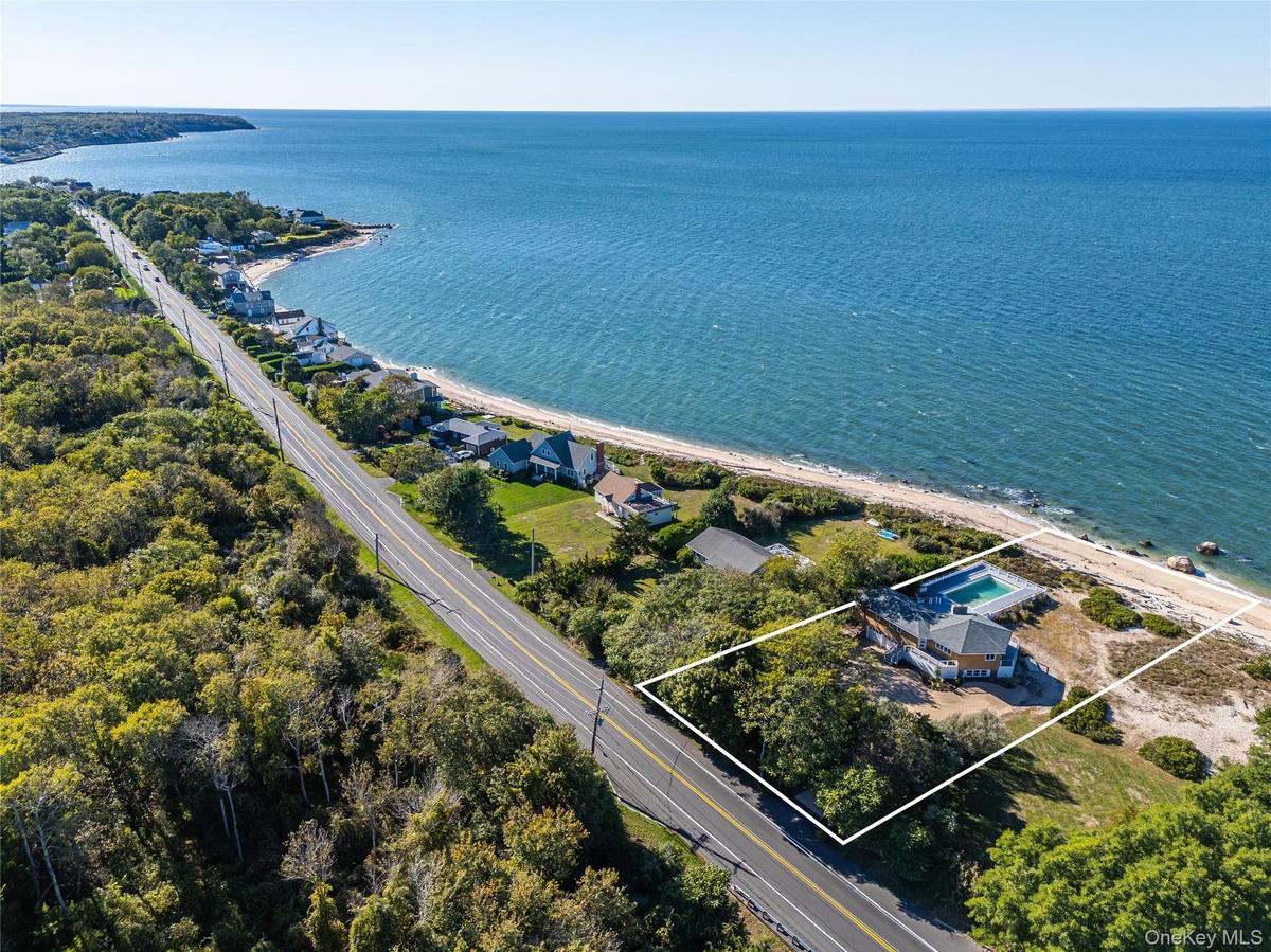 View of property location featuring property parcel outlined and a nearby body of water