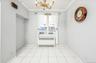 Dining area featuring radiator heating unit, a chandelier, and crown molding