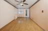 Family room featuring light wood-type flooring, radiator, a ceiling fan, and crown molding