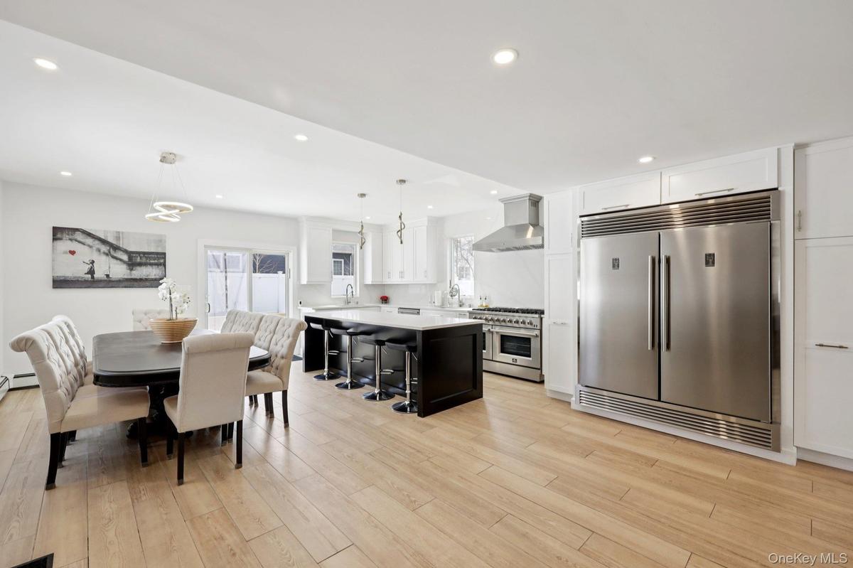 Kitchen with Double sink and full sized fridge and freezer