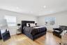 Primary bedroom with walk in closet and en-suite bathroom