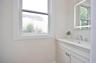 1/2 bath featuring vanity.
